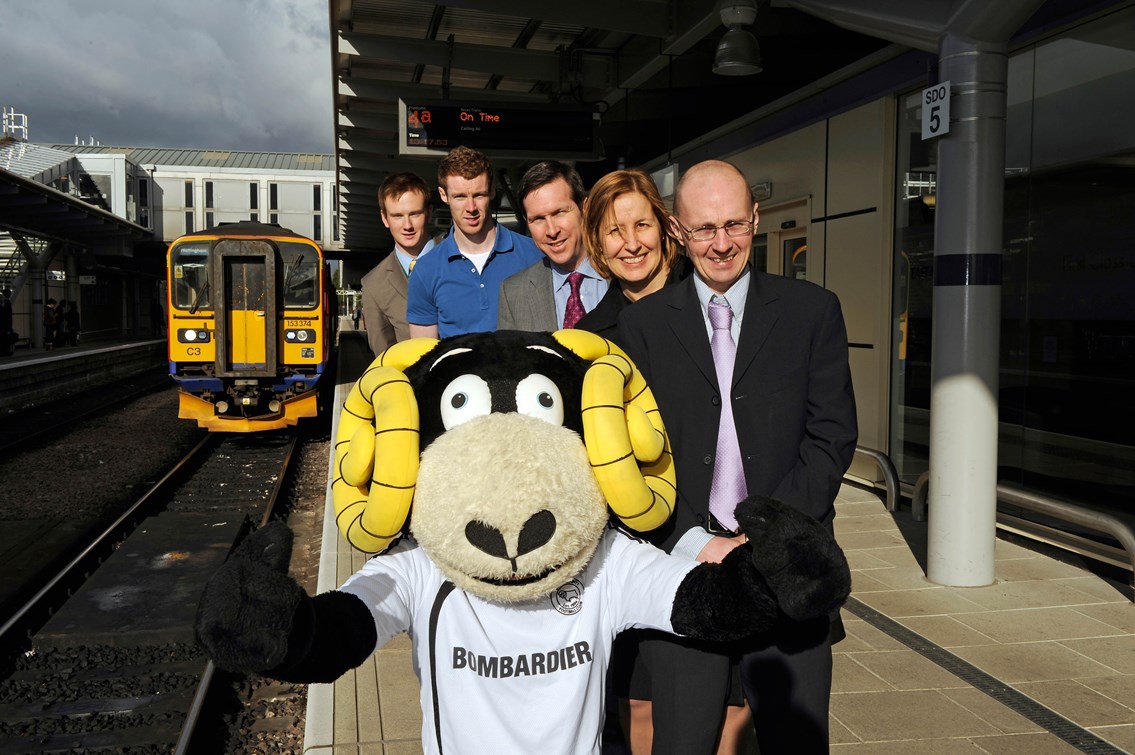 Front to back: Rammie; Martin Brown, operations risk advisor Network Rail; Dyan Crowther, route director Network Rail; Tom Glick, CEO Derby County FC; Stephen Pearson, Derby County FC player; and Richard Pedley, community safety manager Network Rail.: Front to back: Rammie; Martin Brown, operations risk advisor Network Rail; Dyan Crowther, route director Network Rail; Tom Glick, CEO Derby County fc; Stephen Pearson, Derby County fc player; and Richard Pedley, community safety manager Network Rail.