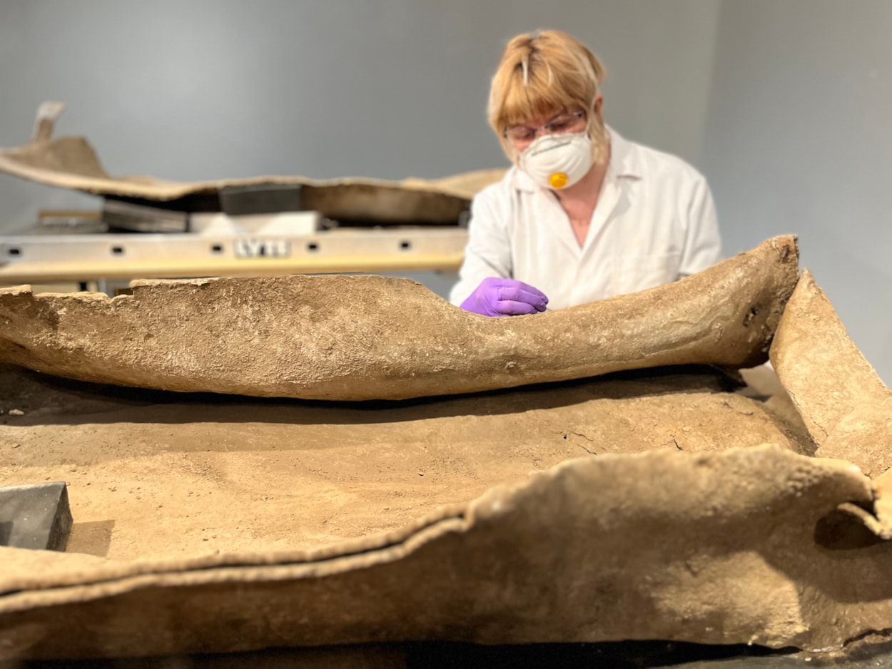 Living with Death coffin display: Emma Bowron, conservator with Leeds Museums and Galleries, works on the ancient lead coffin which lay buried in a Leeds field for more than 1,600 years.
The astonishing discovery, described by experts as a once-in-a-lifetime find, was made during excavation work by West Yorkshire Archaeological Services in a previously unknown site near Garforth.
It will go on display at Leeds City Museum in May as part of a new exhibition called Living with Death.