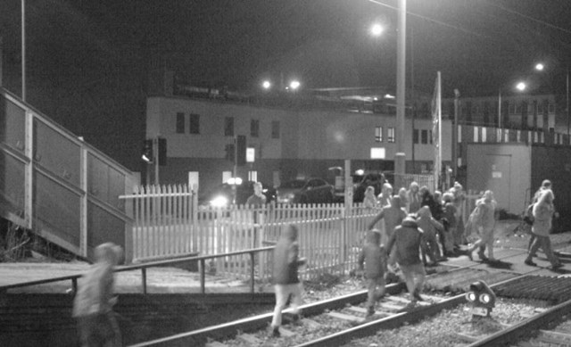 People on the tracks at Grays level crossing in Essex