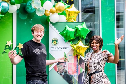 St Aloysius College student Charlie celebrates his A Level results with Cllr Michelline Ngongo