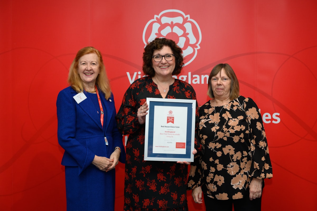 Adele Lavender and Julie Cartwright collecting the award on behalf of Red House Team