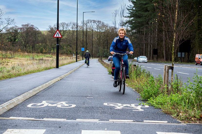 Councillors endorse the Leeds Safe Roads Vision Zero 2040 Strategy: East Leeds Orbital Route lady riding bike on cycle lane.