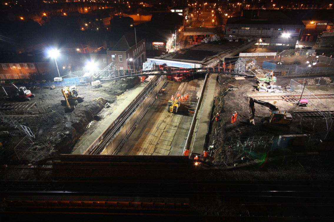 Caversham Road - new bridge deck on the move: The new bridge deck is manouevred into place on top of a huge transporter