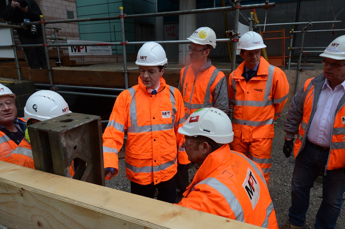 The Chancellor of the Exchequer inspects the site of a new platform at Manchester Airport station