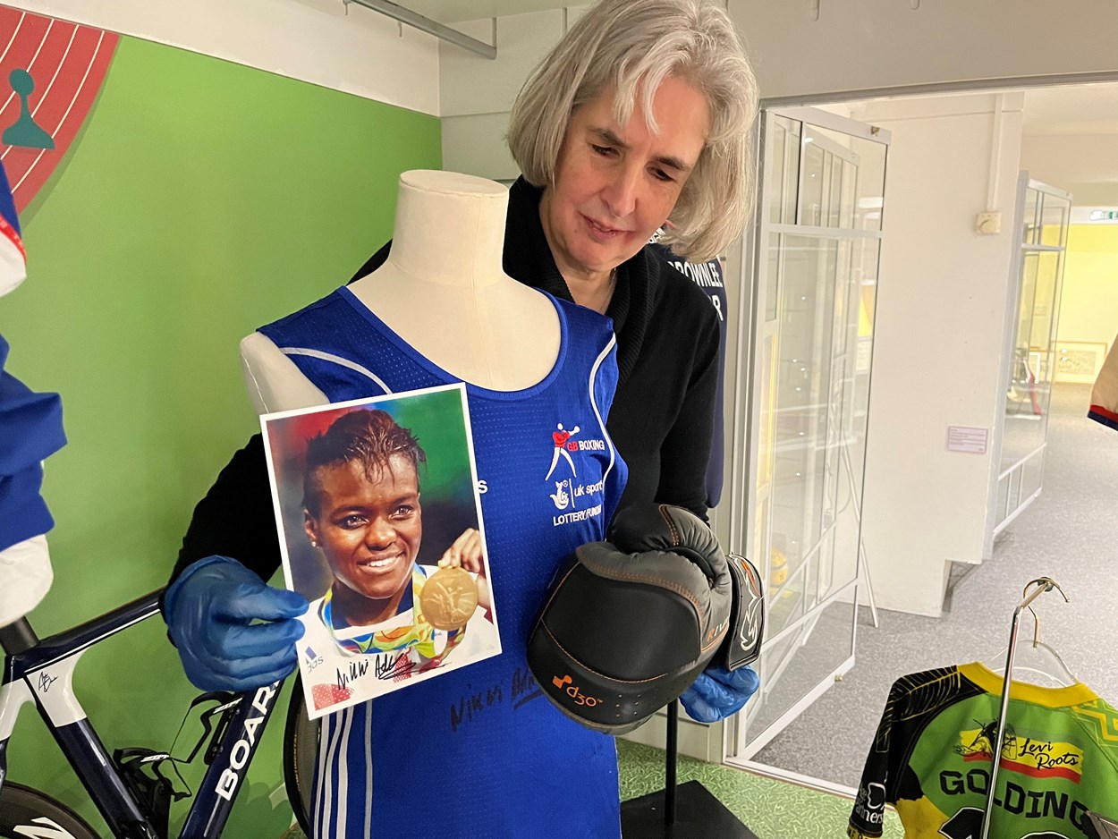 All to Play For: Kitty Ross, Leeds Museums and Galleries' curator of social history, with a glove and kit worn by Leeds-born double Olympic boxing champion Nicola Adams.