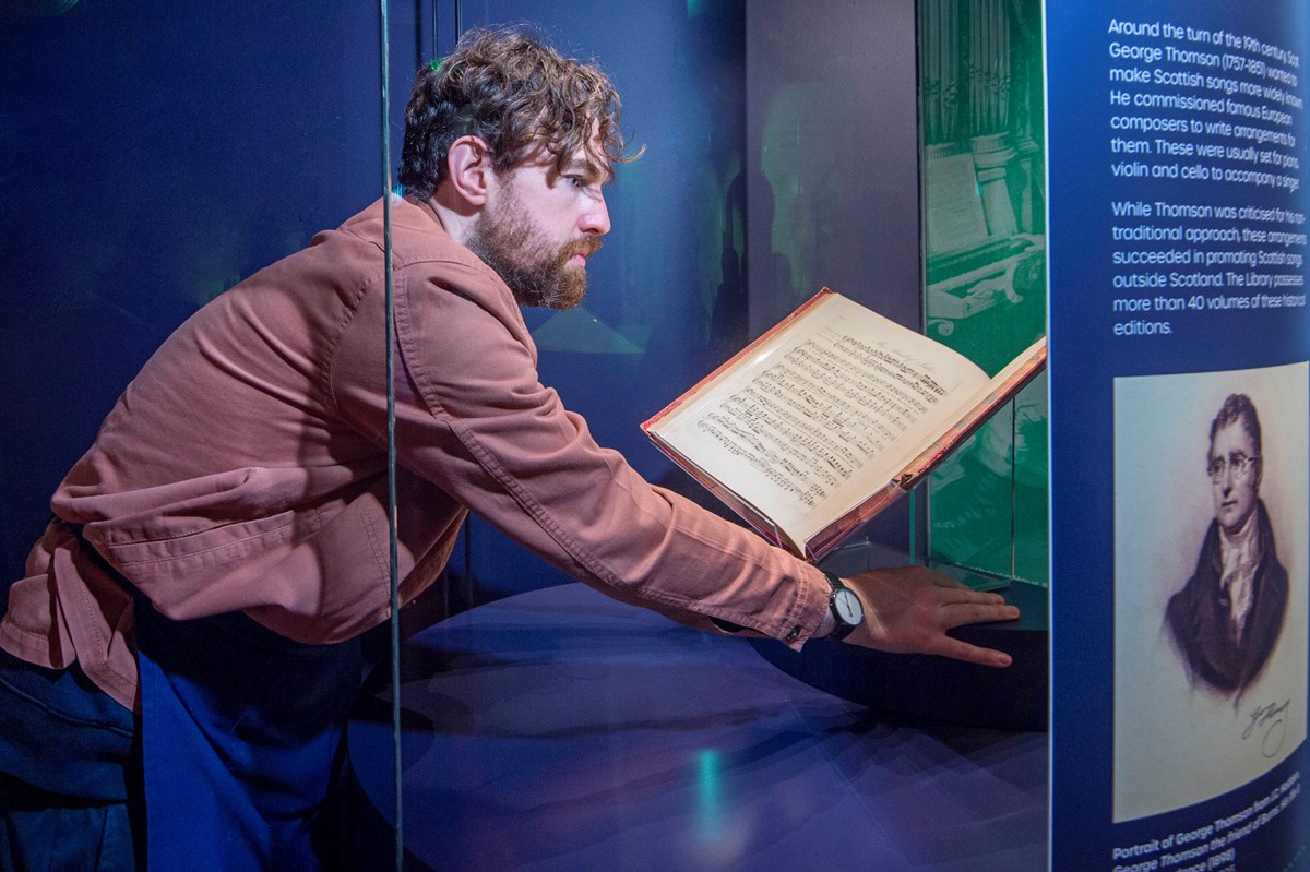 Conservation Exhibitions Specialist Ryan Gibson installing material related to Ludwig van Beethoven. Credit: Neil Hanna