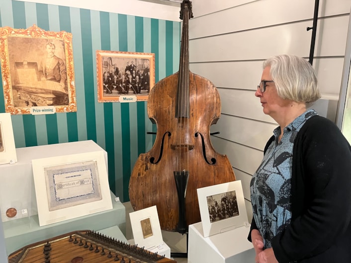 In the Picture: Curator Kitty Ross with a beautiful double bass manufactured by Leeds craftsman Mark William Dearlove, who was violin and bass maker for the Great Industrial Exhibition of all Nations, Crystal Palace, London 1851.
The instrument is on display as part of In the Picture at Abbey House Museum.