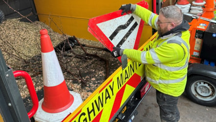 Arborists in LCC's highways team prepare for the storm by putting signs in a van