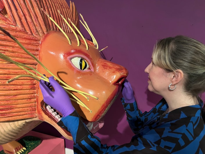 Living with Death: Kat Baxter, Leeds Museums and Galleries' curator of archaeology, with the lion coffin was made by world famous Ghanaian coffin carpenter Paa Joe.
Leeds City Museum’s Living with Death exhibition, which opens today (May 3) features a remarkable array of objects spanning thousands of years of world history and tradition which all explore how different cultures experience death, dying, and bereavement.