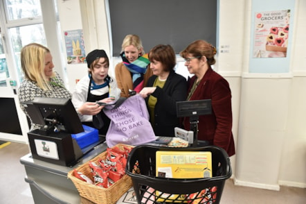 County Councillors Jayne Rear (right) and Phillippa Williamson (second from right) pictured with Sebastian, a pupil at Bleasdale School, and staff from Booths supermarket.