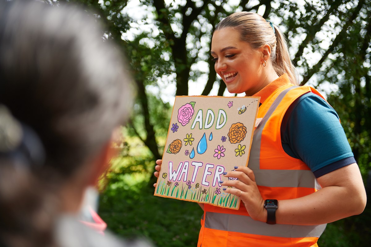 Amelia Bateman, Avanti West Coast Community and Sustainability Champion, teaches pupils how to make bee bombs