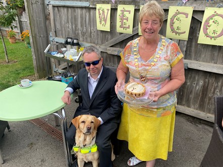Philip Mills with his assistance dog Rye and Cllr Sue Greenaway
