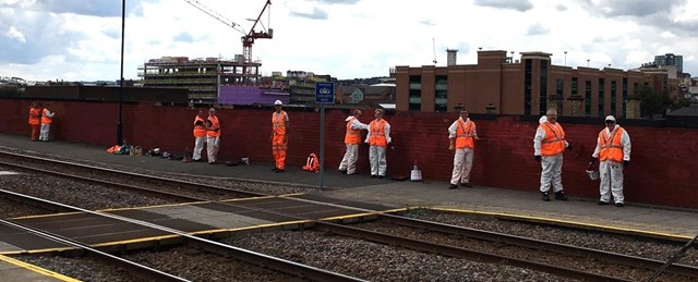 Volunteers from Network Rail cleaned the graffiti from near the railway in Sheffield