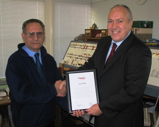 Dali Jabbar retirement: Network Rail Route Director Jon Wiseman congratulates Dali Jabbar on his retirement at Thorpe-le-Soken signal box