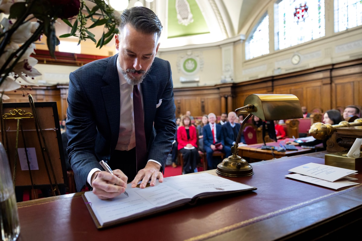 Josh Kroenke, Arsenal Co-Chair, signs the seal to confirm the Arsenal Women's team as Freepersons of Islington