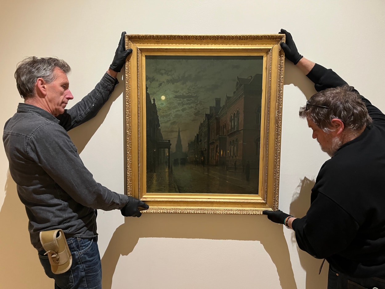 Grimshaw at LAG: Technicians at Leeds Art Gallery hang John Atkinson Grimshaw's famous depiction of Park Row in Leeds, one of the works on display as part of Don’t Let’s Ask For the Moon: Nocturnes and Atkinson Grimshaw, which opens at Leeds Art Gallery this November 14.