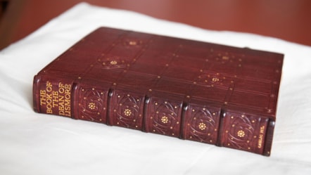 The spine of a book binding. The Book of the Dean of Lismore is printed at the top in gold lettering.