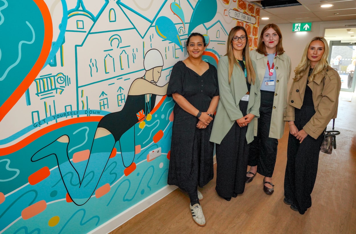 Mural 2: Left to right: Councillor Salma Arif (Leeds City Council’s executive member for adult social care, active lifestyles and culture), Tilly Jenkins (West Yorkshire Combined Authority), Councillor Jess Lennox (Leeds City Council’s executive member for housing) and artist Alexandra Elstone at Doris Storey House.