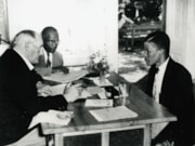 TfL Image - LT Reruiter Charles Gomm interviewing an early Barbadian applicant  1956: TfL Image - LT Reruiter Charles Gomm interviewing an early Barbadian applicant  1956