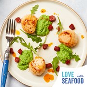 Love Seafood recipes scallops: Photo of cooked scallop dish with Love Seafood logo at bottom right