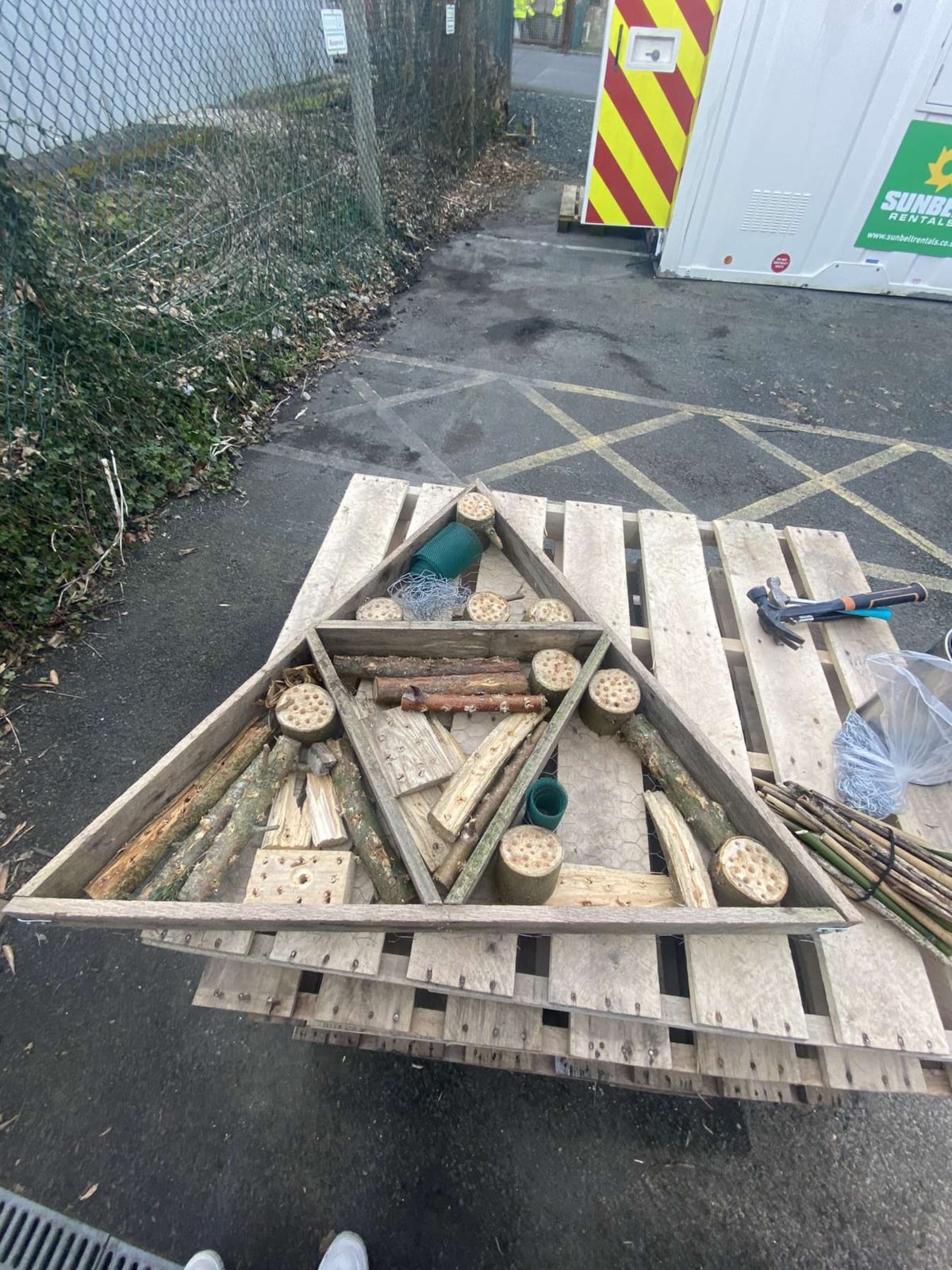 Image shows Year in Industry students creating'Bug Hotels' - 6