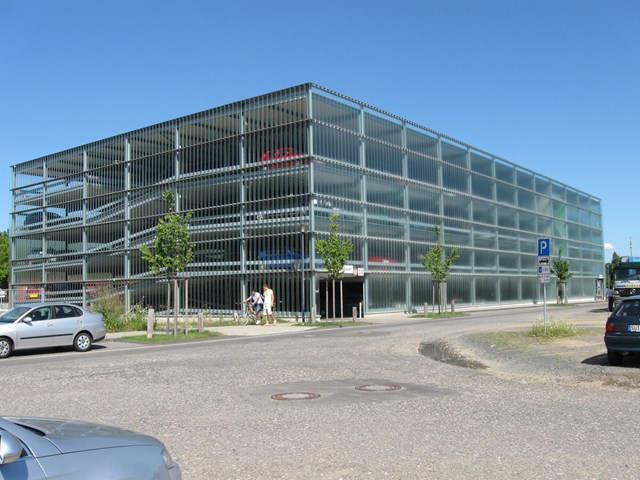 Glass-clad milti-storey car park: Photo of a glass-clad milti-storey car park in Germany, similar to that being built at Wigan North Western station.