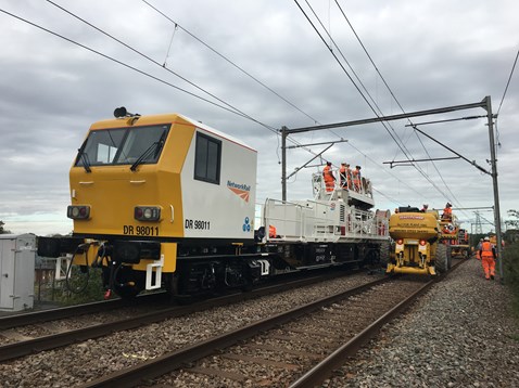 Wiring train installing overhead wires