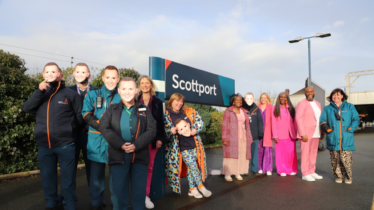 Avanti West Coast team donning Scott Mills masks, The Reverend Kate Bottley, Members of ‘The Sing Out Choir’ and Avanti West Coast Station Manager, Lisa Magee.