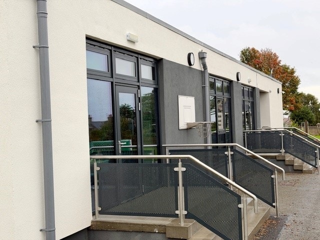 Refurbished exterior of Cullen Primary School, featuring upgraded windows, doors and external access areas.