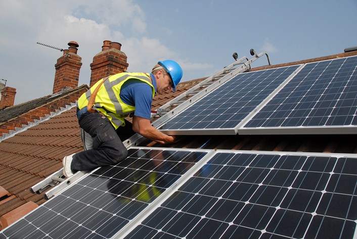 Solar panel project powers up: installingsolarpanels.jpg