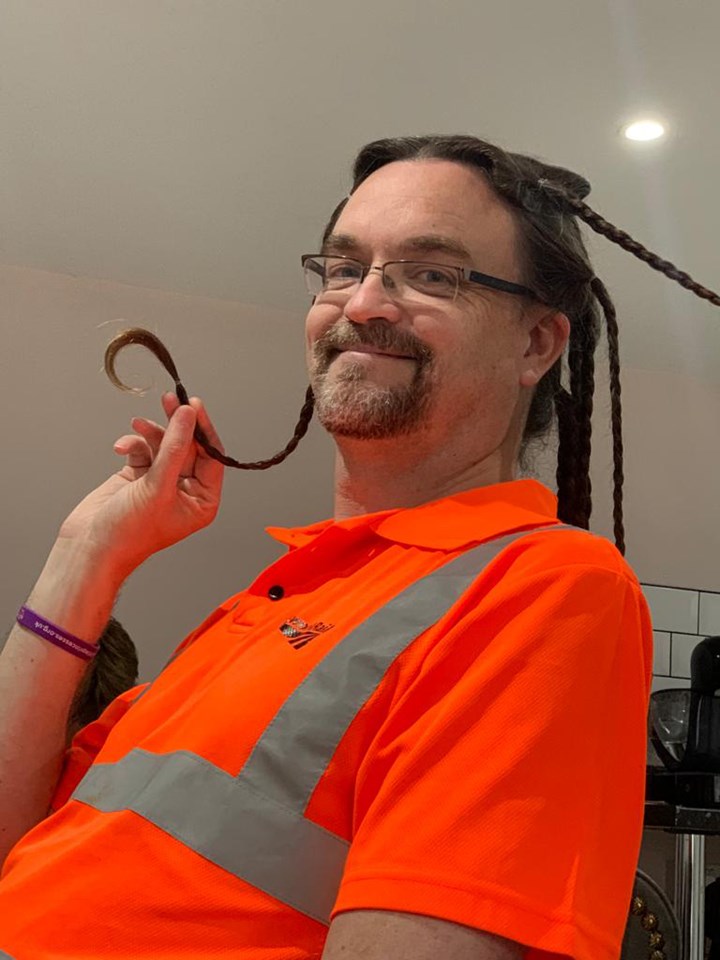 Stuart Hughes with hair in braids saved for wig making copy