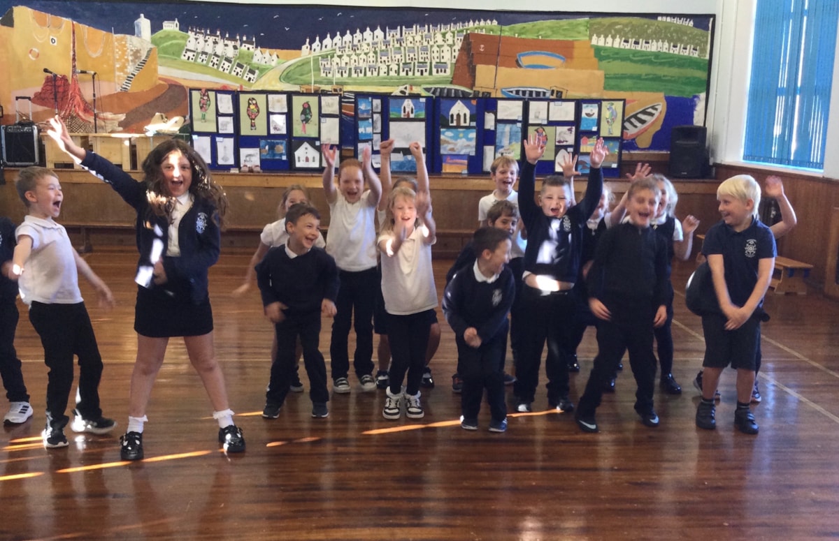 Findochty Primary School pupils celebrate after receiving the gold reading award.