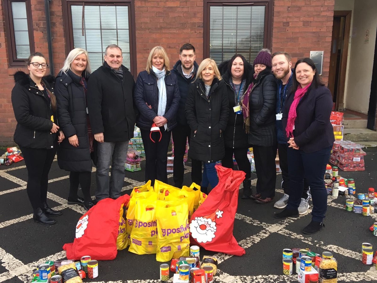 Cllr McMahon with Vibrant Communities and a representative from the Park Hotel getting the food parcels ready