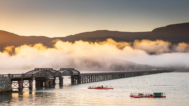 Passengers reminded to plan ahead as track upgrades begin in Barmouth and Cambrian Coast line: Barmouth Viaduct clouds at dawn 2  Credit Dom Vacher Oct 2022