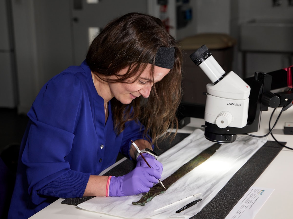 Conservator Bethan Bryan works on the Bronze Age Carnoustie Hoard. Photo © National Museums Scotland (3)