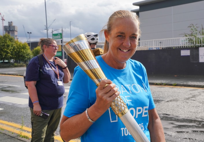 Baton of Hope - Leeds tour 4: Baton bearer Emma Oliver carries the baton in Holbeck as the Baton of Hope tour comes to Leeds on World Suicide Prevention Day.