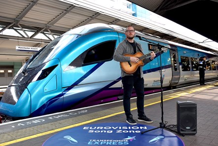 Jimmy Page plays for passengers at the TransPennine Express Eurovision Song Zone