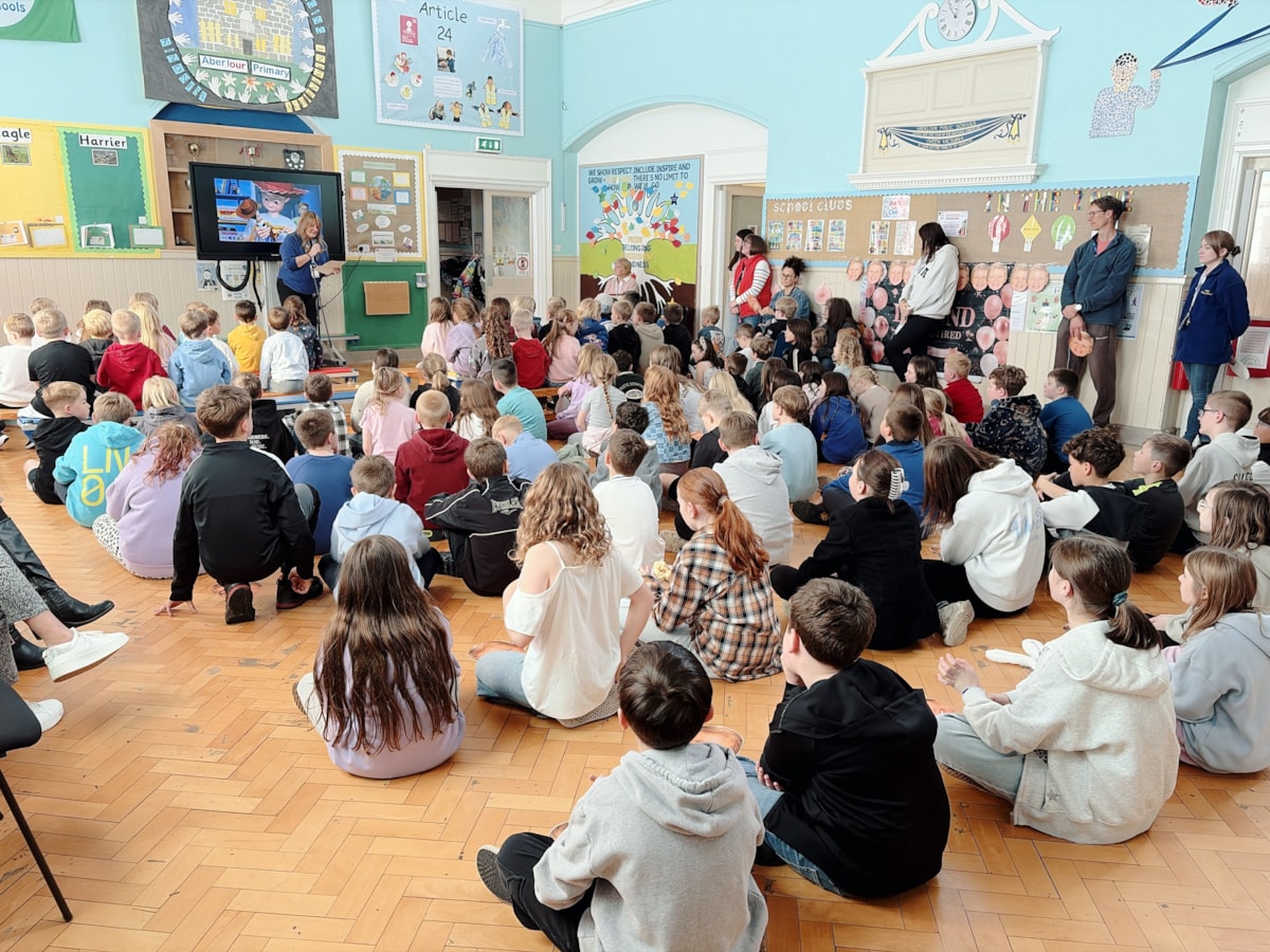 The current children of Aberlour Primary School listen to Head Teacher, Mandy Inkson, paying tribute to Hester Allan as she retires from the school after 26 years.