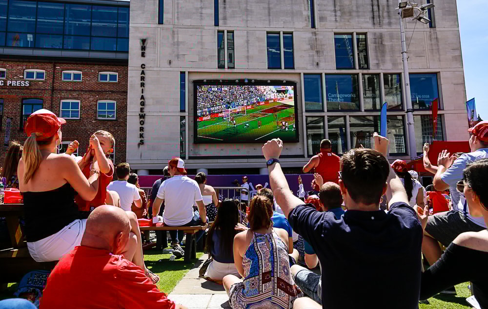 Millennium Square England women's football: Crowd watching the England women's team in action on the big screen in Millennium Square
