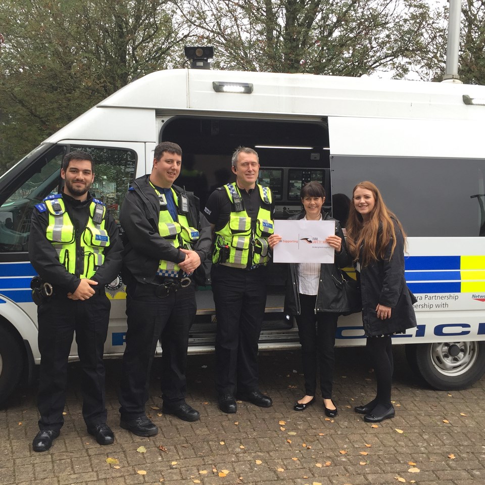Cardiff Councillor Sarah Merry and Gemma from the  road safety centre with BTP officers during Rail Safety Week 2017