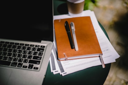 Pens and paper on a desk