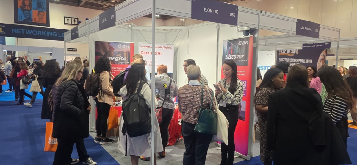 Women in tech expo stand visitors