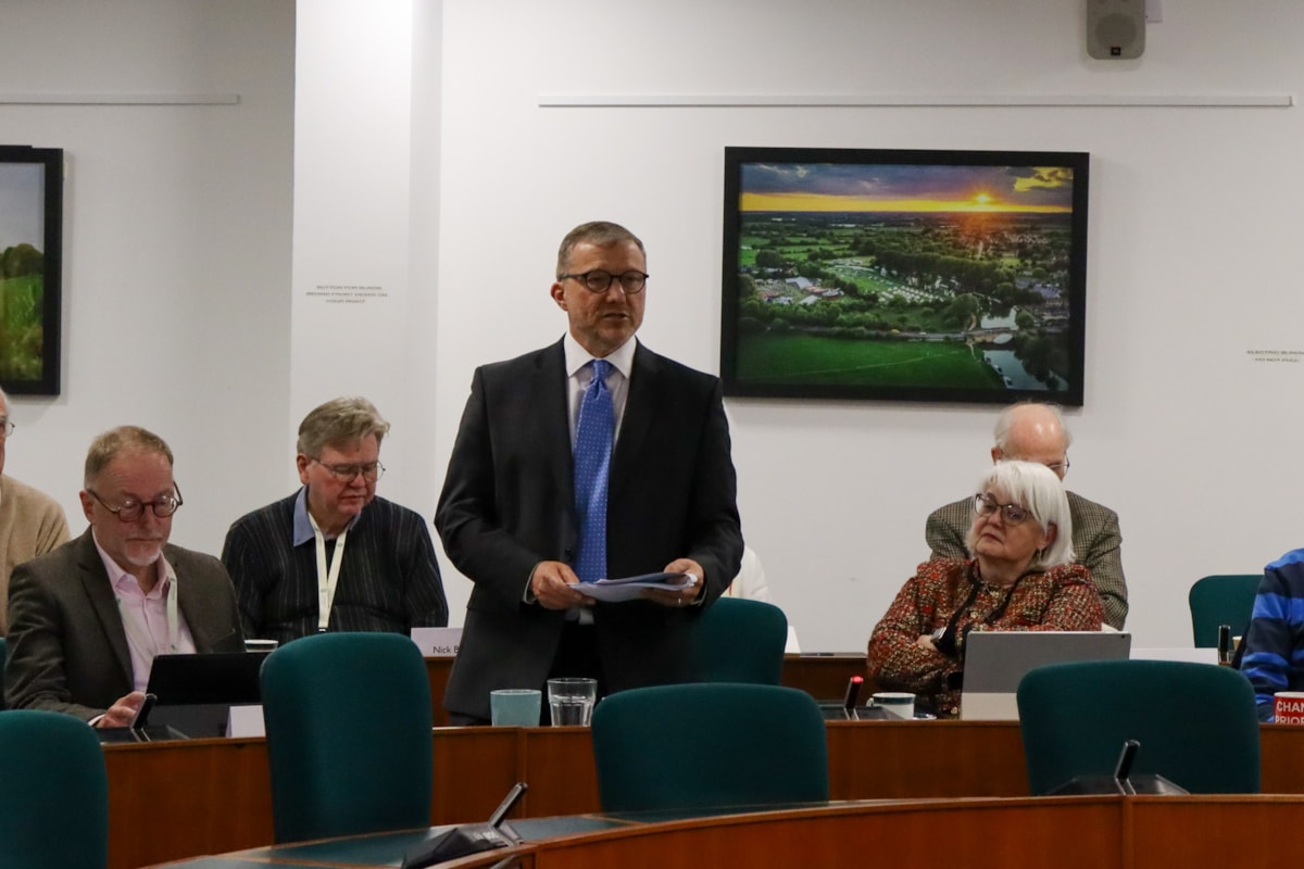 Cllr Mike Evemy at a Full Council meeting discussing LGR proposals