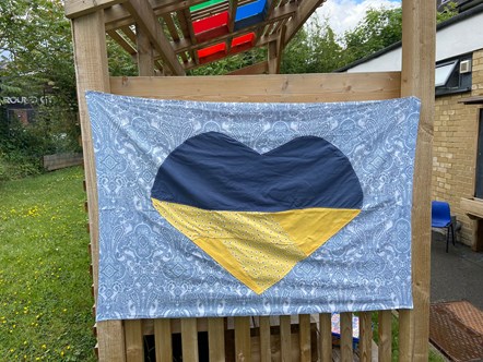 The Ukrainian flag displayed in the foyer of Christ The King Catholic Primary School, made from school uniforms.