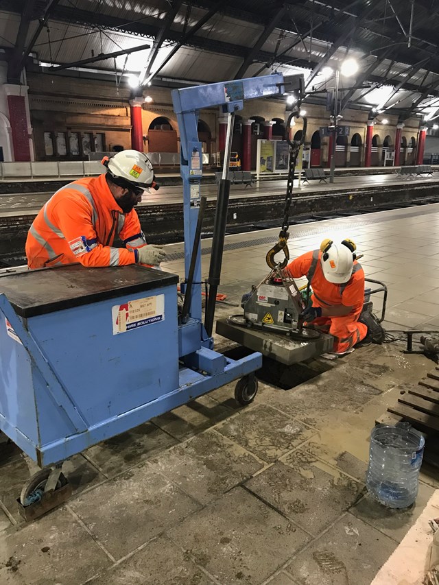 Lifting the historic Yorkstone into position at Lime Street station