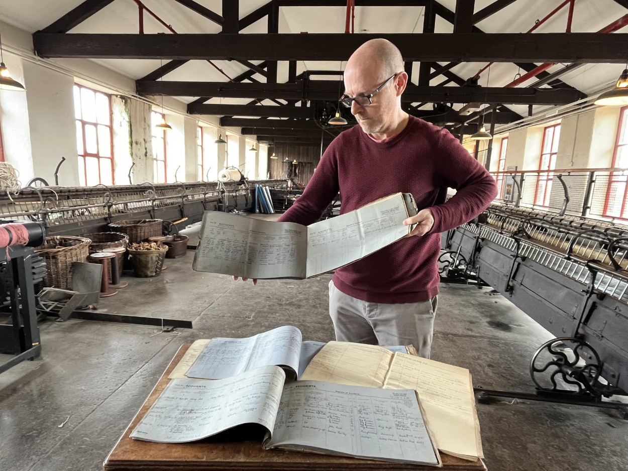 Leeds Industrial Museums accident book: John McGoldrick, Leeds Museums and Galleries' curator of industrial history, who discovered the historic employee records stashed in a box 
Carefully listed within were scores of incidents which lay bare the harsh working conditions and gruelling lifestyle endured by the city’s textile workers shortly after the turn of the 20th century.