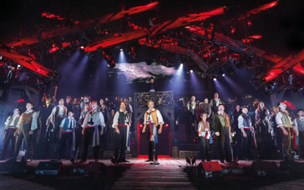 LES MISERABLES THE ARENA SPECTACULAR. Enjolras (James D. Gish) and Ensemble - photograph by Danny Kaan