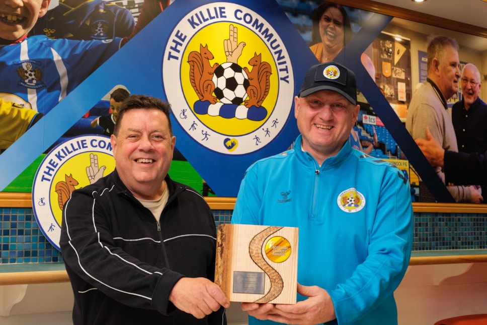 Councillor Reid congratulates Scott on this award