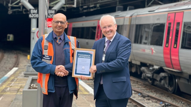 West Midlands railwayman celebrates 50 years of service: Paul being presented with his long-service award by Fraser Pithie, station operations manager