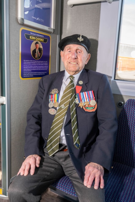 Ken Cooke inside bus with tribute plaque 2